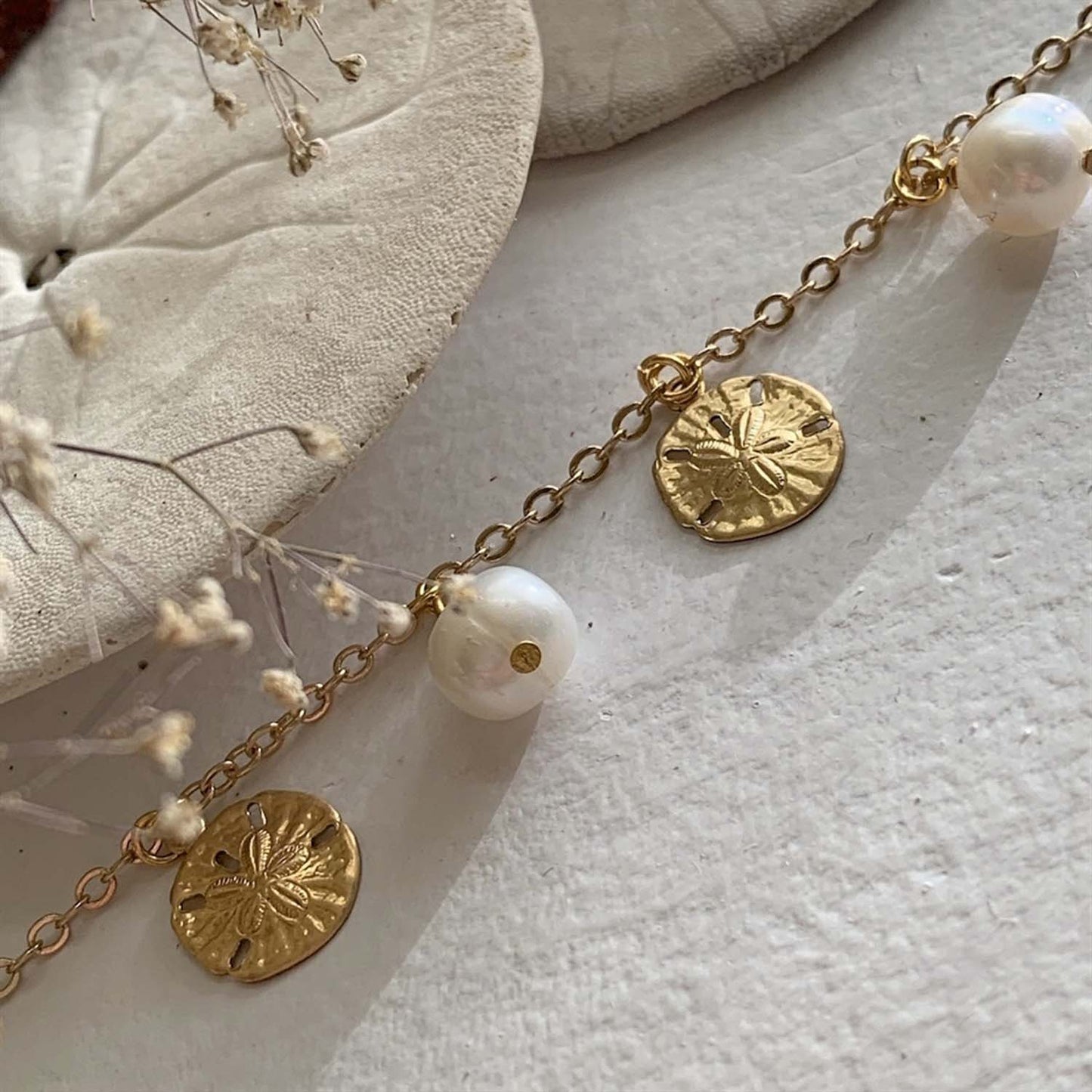 Amphitrite Pearls And Sand Dollar
