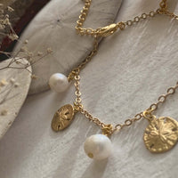 Amphitrite Pearls And Sand Dollar