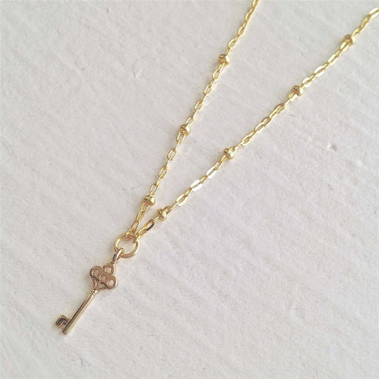 Minerva Tiny Key Charm Gold Necklace