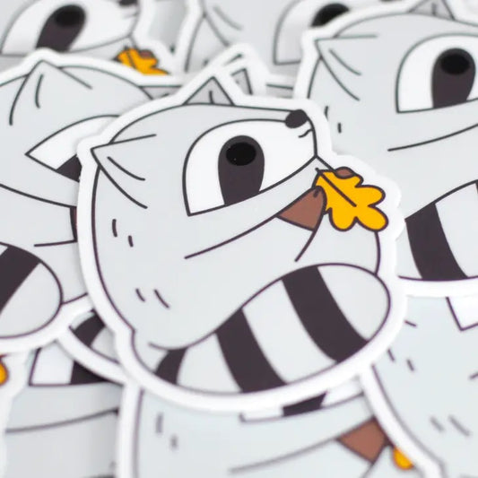 Raccoon Holding Leaf Sticker